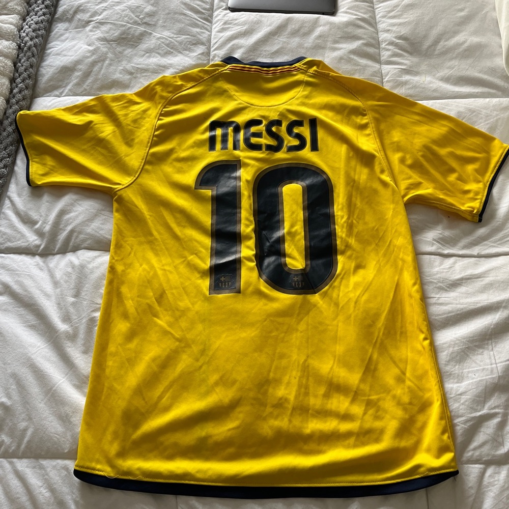 FC Barcelona 2008/2009 Away Jersey, with Lionel Messi on the back of the jersey.